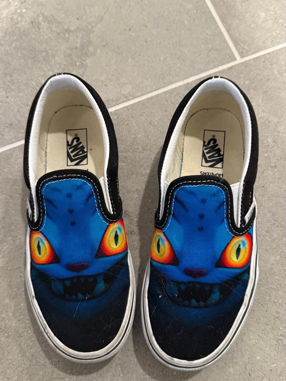 Vans Kids Blue Cat Face Slip-On Sneakers with Yellow-Orange Eyes